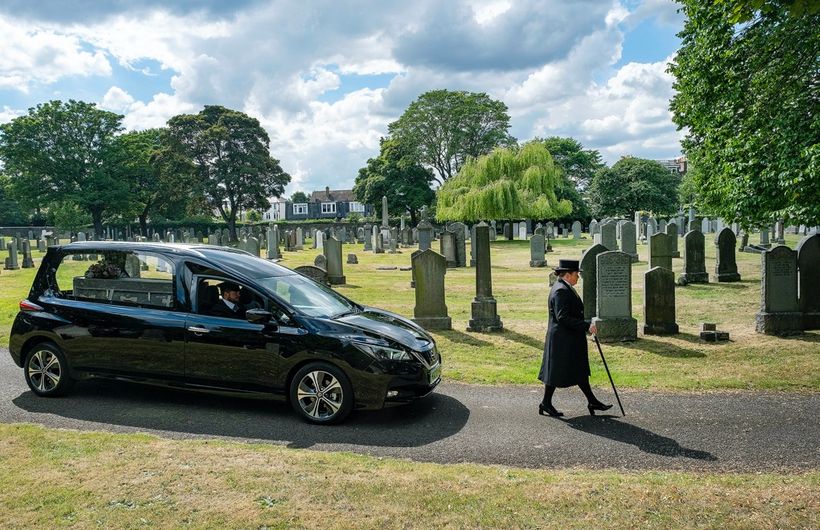 Funeralcare Nissan Electric Hearse, Black, Moving shot, side angles